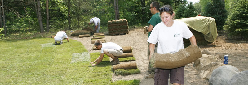 Amy and staff laying sod. 